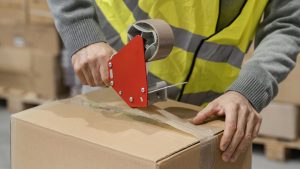 Man in warehouse working with packages